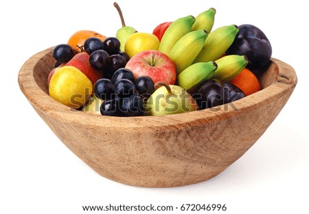 Wooden fruit bowl isolated over white background Royalty-Free Stock Photo #672046996
