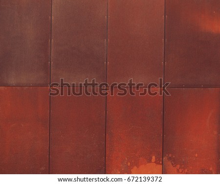 Bright orange red rusty wall texture. Tiled. Copy Space. 