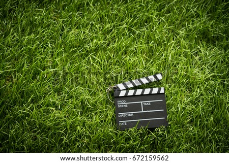 A mini slate film on the grass