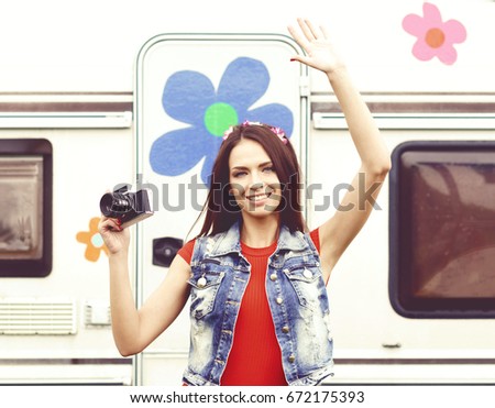 Young, beautiful hipster girl with vintage camera outdoors at summer. Vacation, holiday, concept.