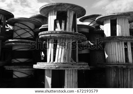 Black and white wooden spools