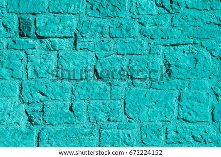 Old stone wall in aqua color