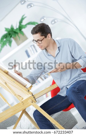 portrait of a young male artist at work
