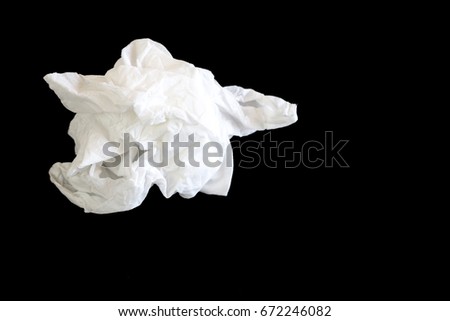 used of white tissue paper isolated on black background Royalty-Free Stock Photo #672246082