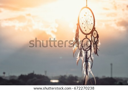 Dream Catcher Sky and blur Background,boho chic, ethnic amulet,symbol Royalty-Free Stock Photo #672270238