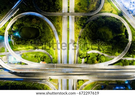 Road beautiful Aerial View of Busy Intersection at Night , top view , thailand .Aerial of Freeway