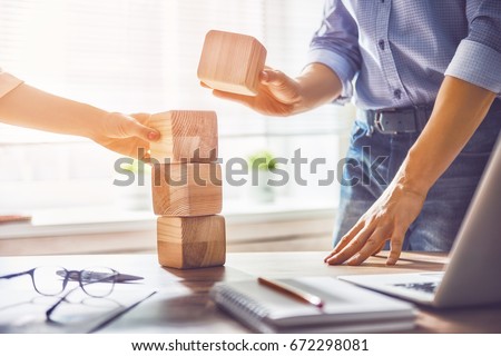 Two business persons plan a project. Team work in office. Royalty-Free Stock Photo #672298081