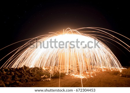  glowing sparks from spinning steel wool