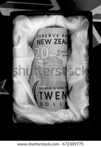 New Zealand dollar notes in a casket.