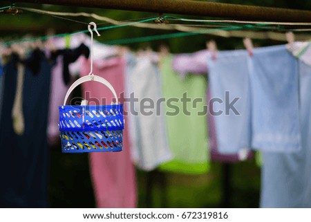 laundry ,drying sheets on the line in the backyard,colorful blurry background