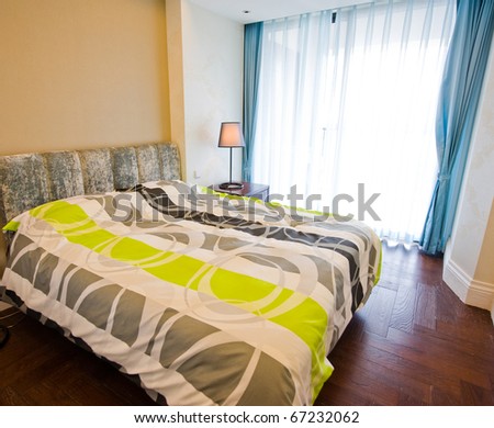 Modern tastefully decorated master bedroom.