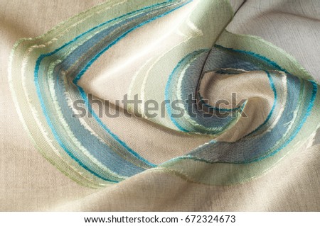 Texture, background, pattern. Silk fabric. Circles green blue on a dark background Greeting card. Silk scarf, shawl. Holidays.