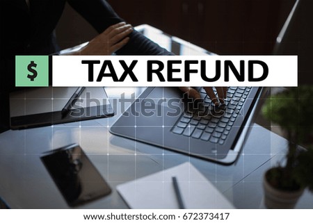 Tax refund text on virtual screen. Business and Finance concept. 