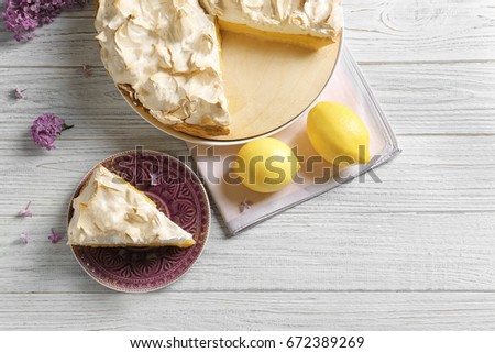 Piece of delicious lemon meringue pie on plate