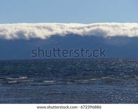 Fog rolling out of the lake and getting stuck on the mountains of Lake Tahoe, CA