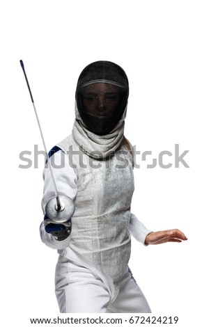 Portrait of Young woman fencer wearing mask and white fencing costume. Attacking pose. Isolated on White Background Royalty-Free Stock Photo #672424219