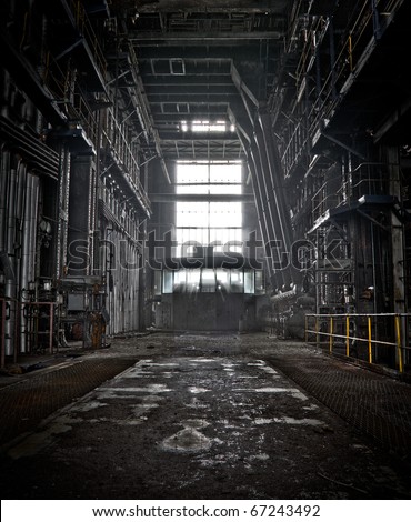 The interior of a machine hall at an abandoned industrial area Royalty-Free Stock Photo #67243492