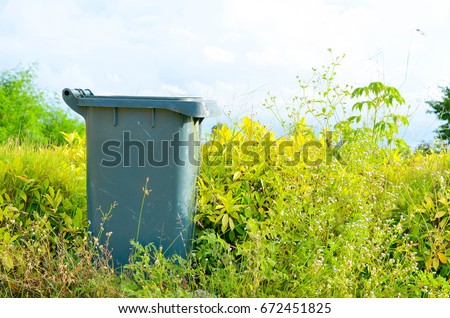 old green bin in the garden, use from garbage recycle bin 