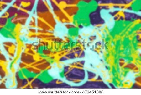 Unsharp abstract background. Blurred abstract color background. Abstract stains of paint on wall. Abstract colored paint stains on city wall. Stains and stains of bright paint on wall of building