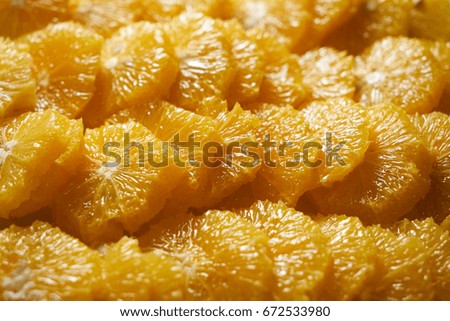 Peeled Sliced oranges. Orange background. Top view, close-up 