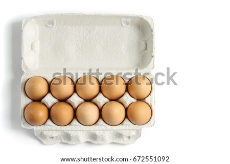 Eggs in cardboard rack on white background, mock up, copy space
 Royalty-Free Stock Photo #672551092