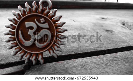 om pendent on wood texture background and greeting 