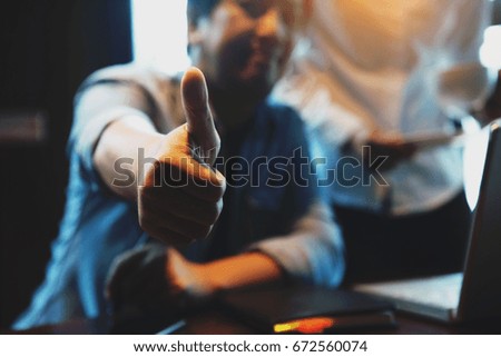 Man showing thumb up, close up shot ,soft picture