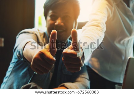 Man showing thumb up, close up shot ,soft picture