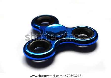 isolated hand spinner. Royalty-Free Stock Photo #672593218