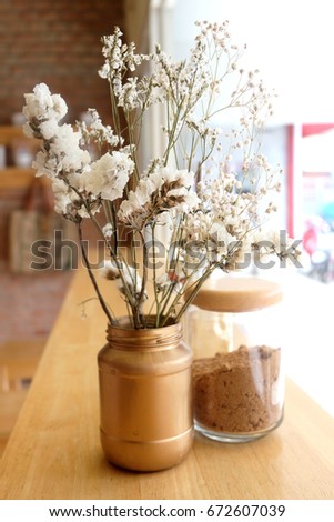 dried Gypsophila on wood table in coffee shop,close up