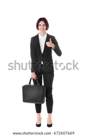 Modern business woman isolated on white background. Fashionable young brunette wearing black suit. Portrait of modern and happy business woman in black suit, isolated on white background.