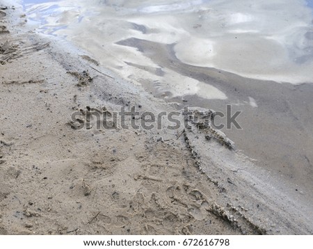 Sand and clear water