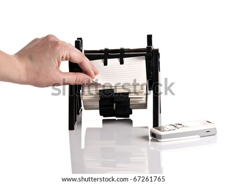 Female hand browsing rotary card organizer