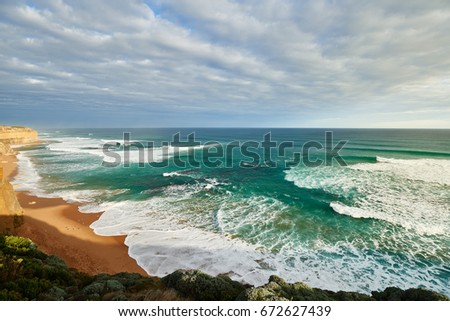 Great Ocean Road with blue sky sunlight and green water in winter season, Australia.
