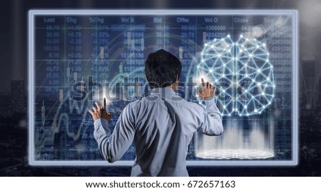 Back side of Businessman hand touching the technology digital virtual screen over the Stock market chart background, business innovation concept