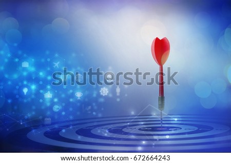 Close up shot red dart arrow on center of dartboard over bokeh background with copyspace and hexagon block chain and business icon, mix media