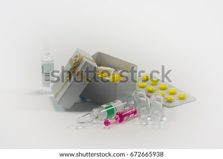 Tablets and capsules in the set on a white background multicolored