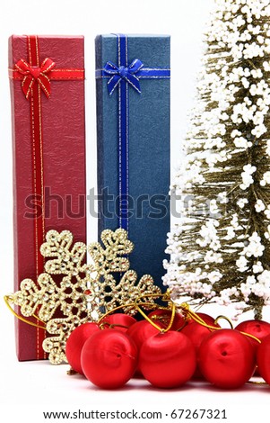 red and blue holiday box with christmas tree and ornament