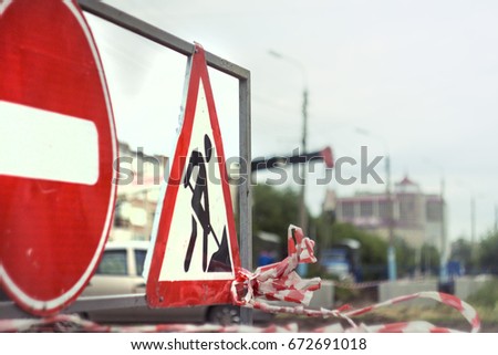 Sign travel prohibited on the blurred background of the road under construction