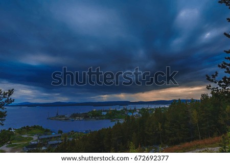 Sunset over Lake in forest. Russia