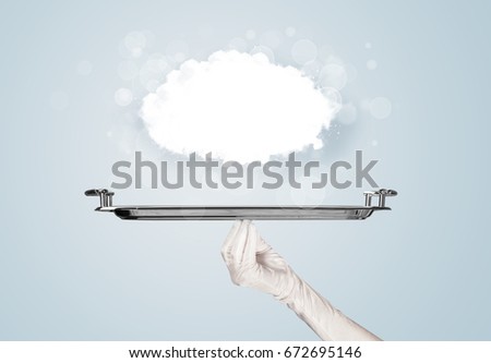 An elegant waiter business hand in white glove holding a plate with empty clear cloud in front of blue gradient background.