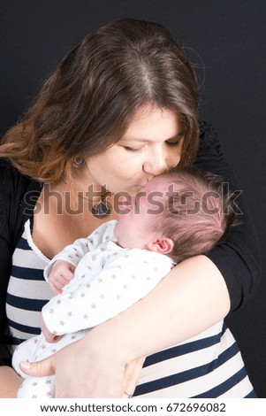 mother with her baby kiss and love