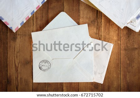 Open envelope on a wooden table