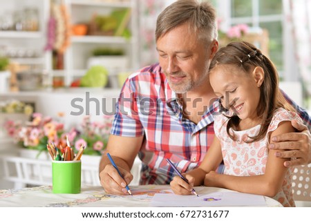 Father and daughter  drawing picture