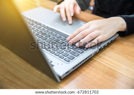 close up hand of business women typing keyboard on laptop. business people and technology concept.
