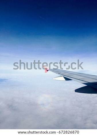 Blue sky with Wing of an airplane. Photo applied to tourism operators. picture for add text message or frame website. Traveling concept