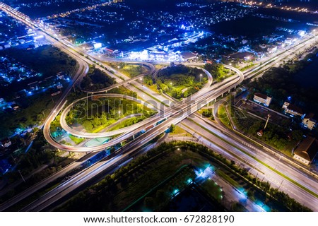 Road beautiful Aerial View of Busy Intersection at Night , top view , thailand .Aerial of Freeway.