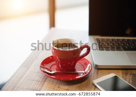 laptop and black coffe in vintage tone

