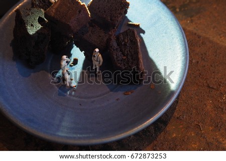 Miniature people survival brownie ,idea concept 