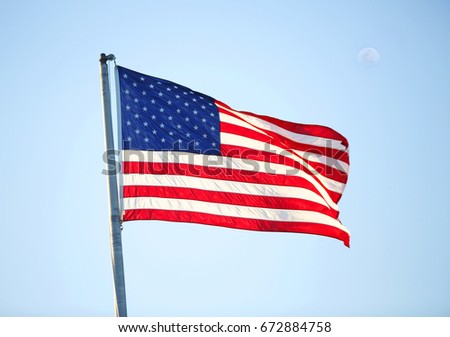 American flag isolated in a blue sky